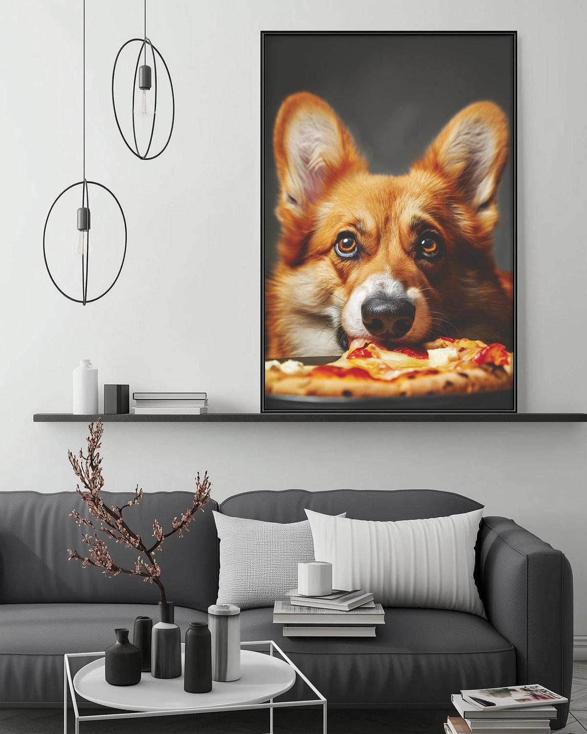 a large framed picture of a dog eating pizza, which is hanging on a wall above a gray couch in a living room setting.