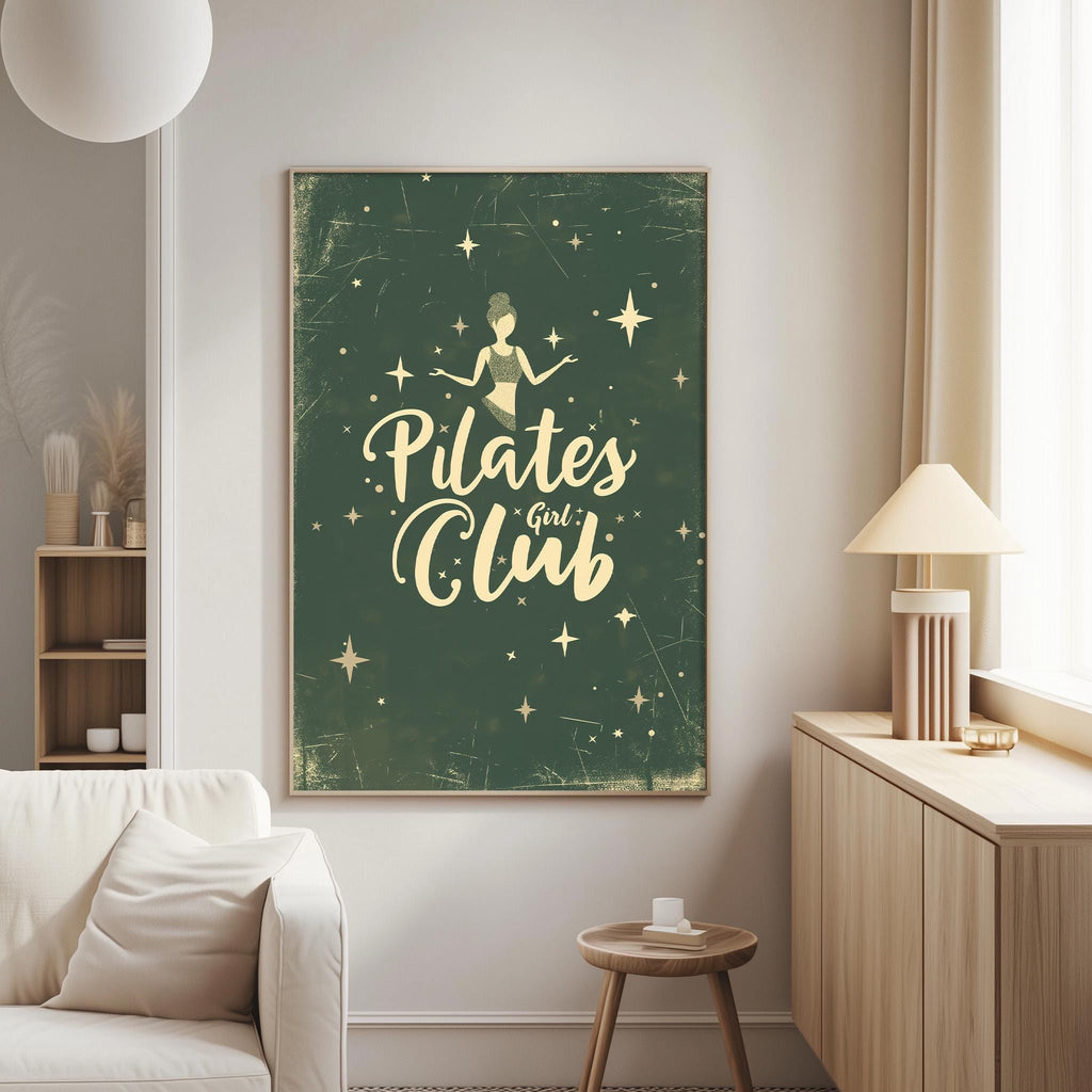 a living room with a large framed poster on the wall that says "Pilates Club".
