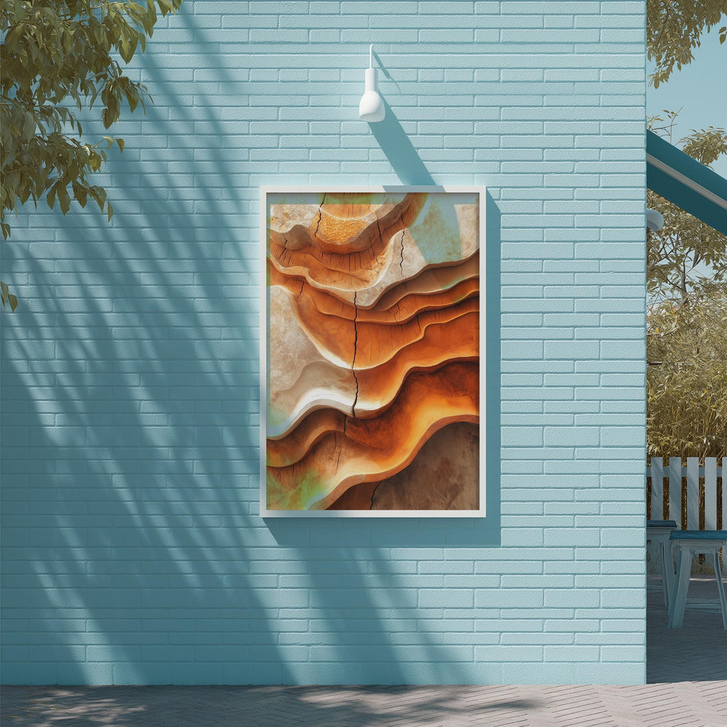 a large abstract painting hanging on a blue wall, with a white light fixture above it.