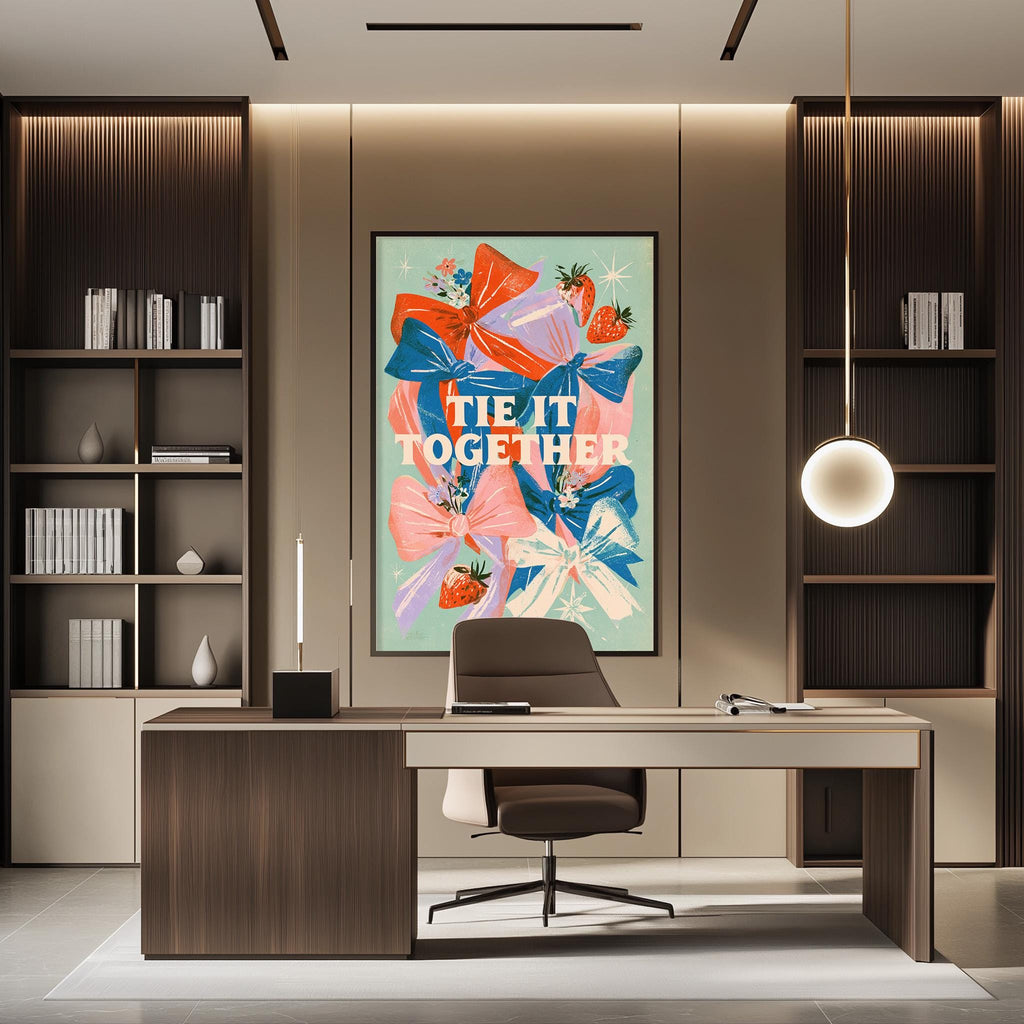 a modern office space with a large framed poster featuring a colorful floral design on the wall. The poster has the text "tie it together" written on it. The office has a wooden desk, a chair, and a bookshelf filled with books. The overall design and decor create a professional and stylish atmosphere.