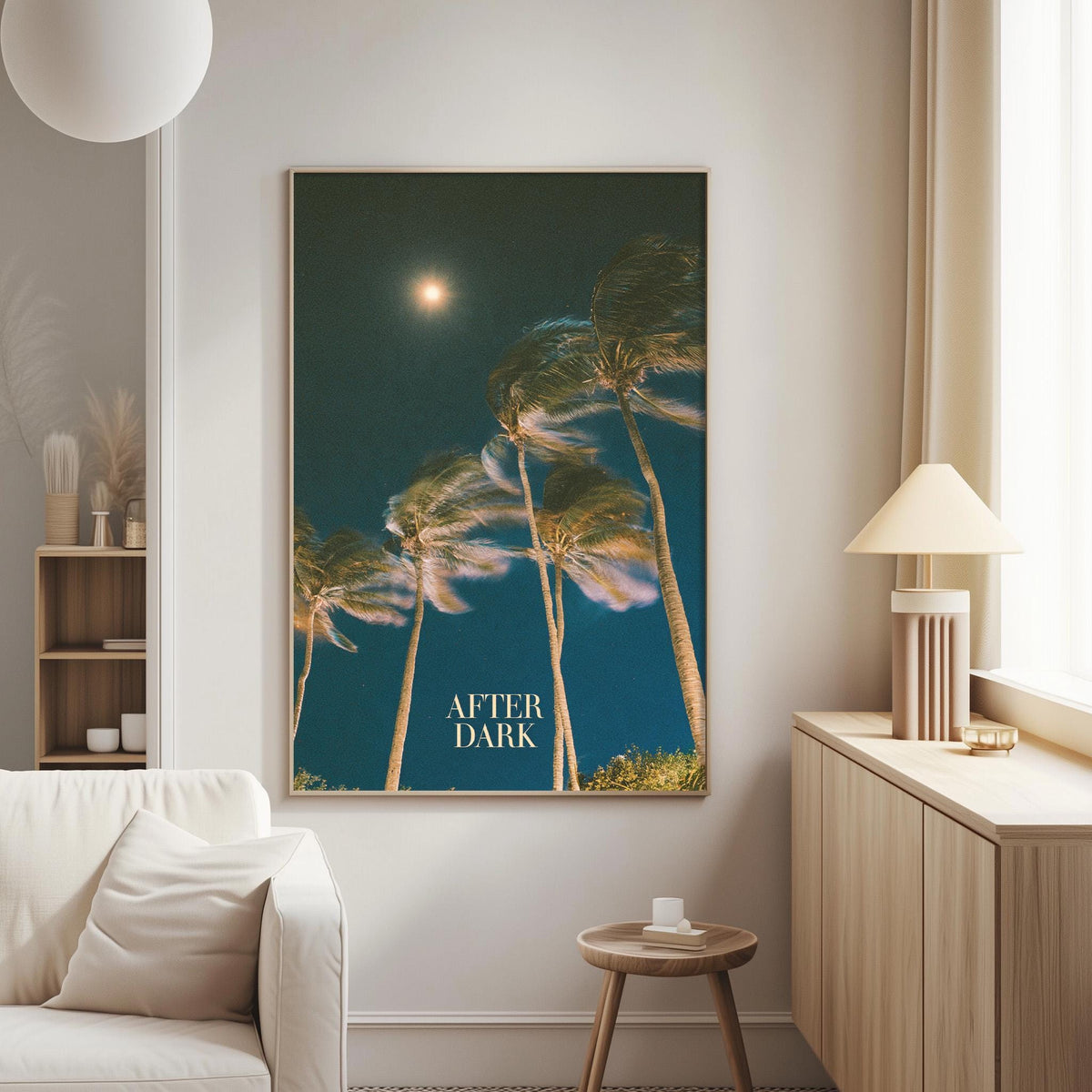 a large framed poster of swaying palm trees against a dark blue sky, with the word "AFTER DARK" written on it.