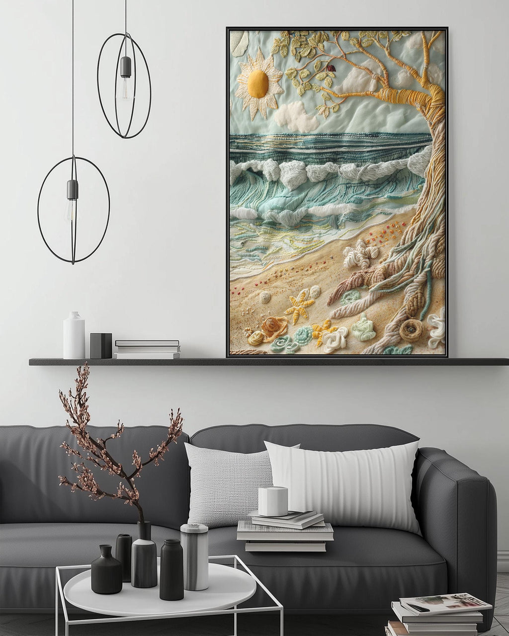 a large framed artwork depicting a beach scene with a tree, waves, and a bird in the sky, hanging on a wall above a gray couch with decorative items on it.