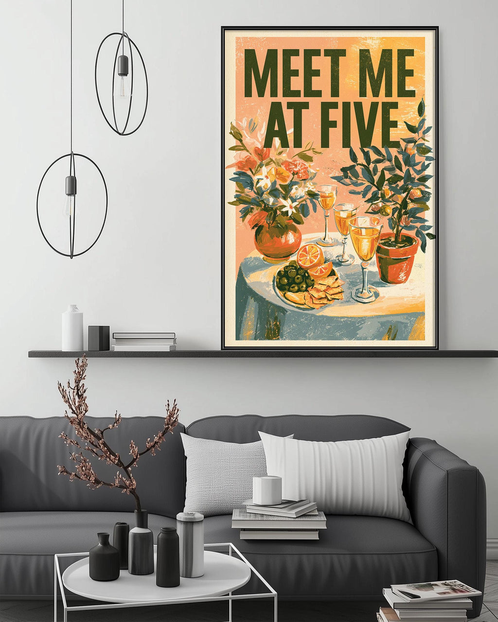 a cozy living room with a gray sofa, a coffee table, and a framed poster of a table with flowers and wine glasses. The poster has the text "MEET ME AT FIVE" written on it.