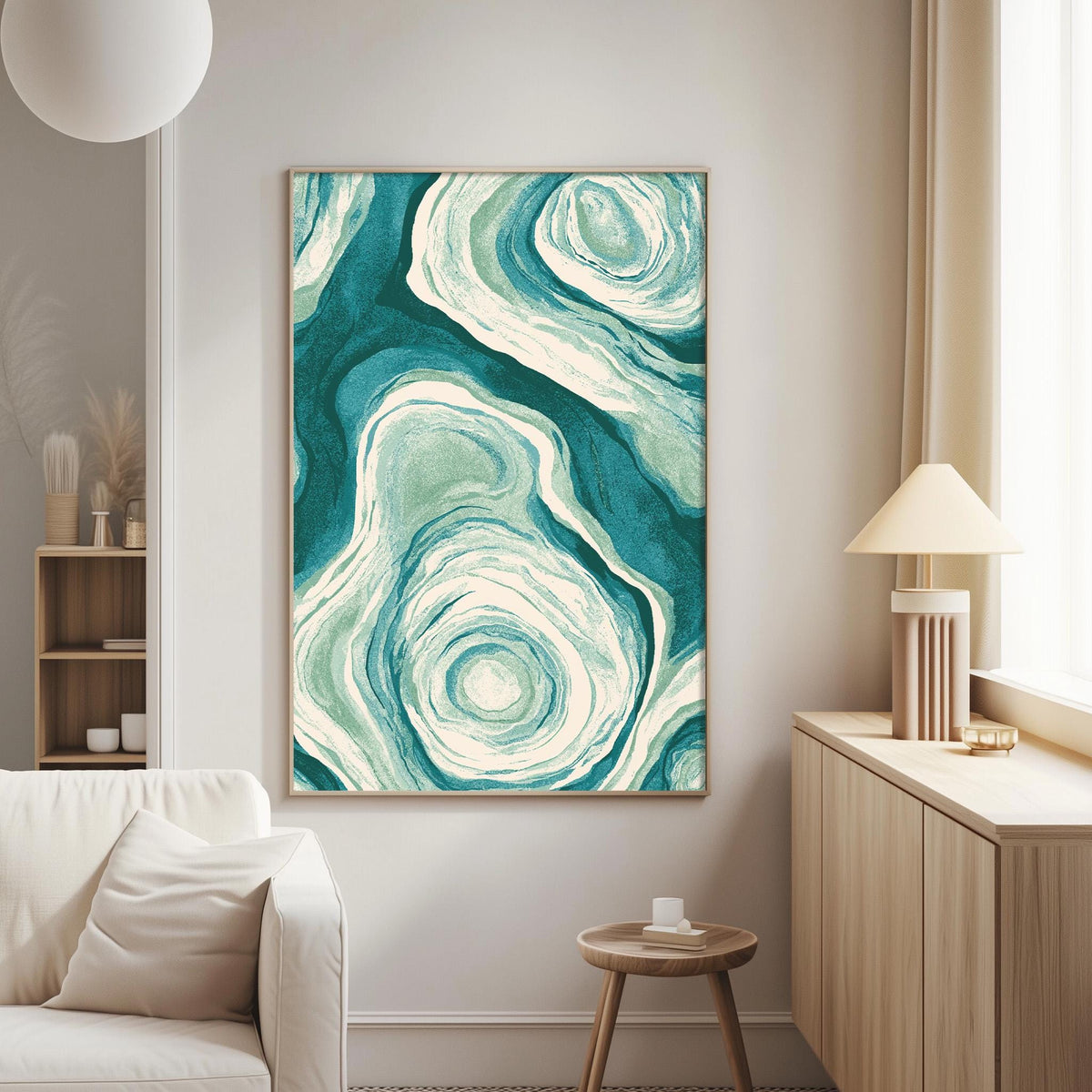a living room with a large abstract painting hanging on the wall, a white sofa, a wooden side table, and a lamp on a wooden cabinet.