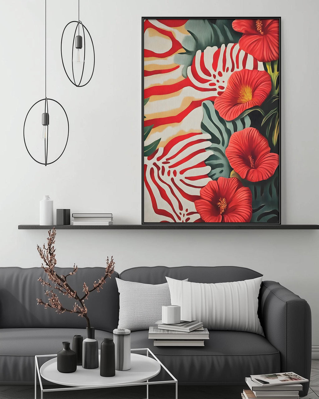 a modern living room with a gray sofa, a coffee table, and a large framed print of red flowers on the wall above the sofa.