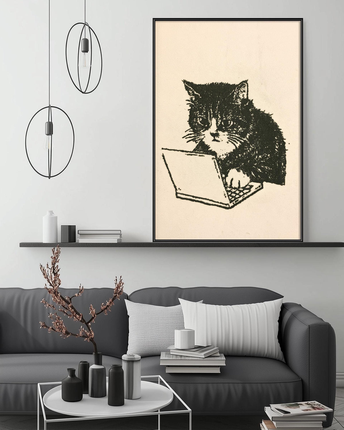 a black and white cat sitting on a couch and using a laptop computer.