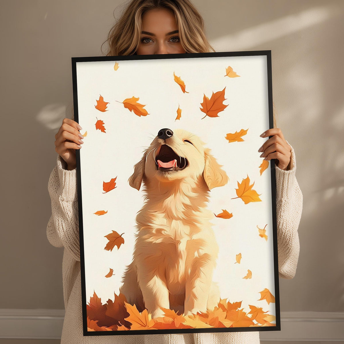 A woman holds up a framed picture of a golden retriever dog with its mouth open, surrounded by falling orange leaves.