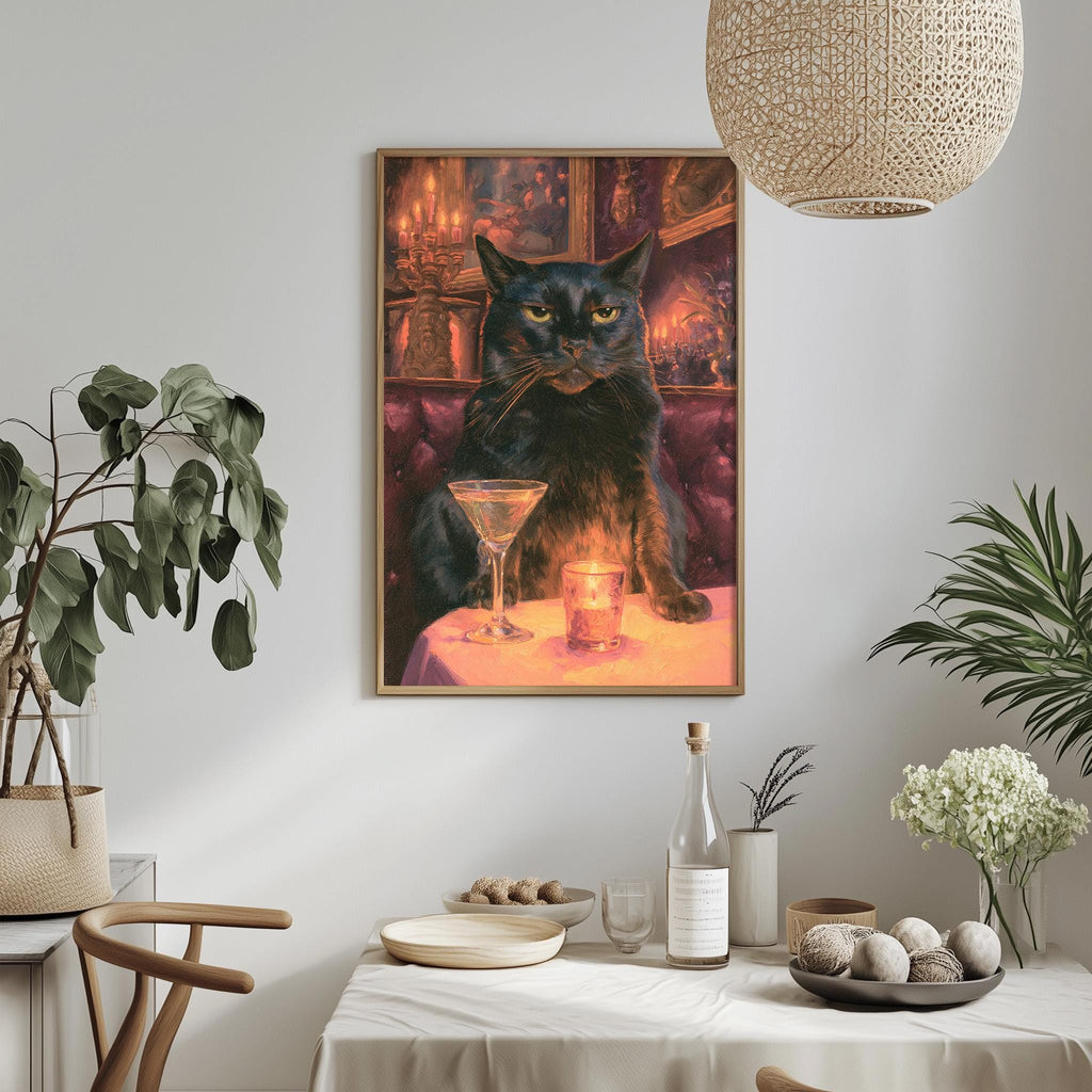 a framed painting of a black cat sitting at a table with a martini glass and a candle, surrounded by various decorative elements such as plants, vases, and bowls.