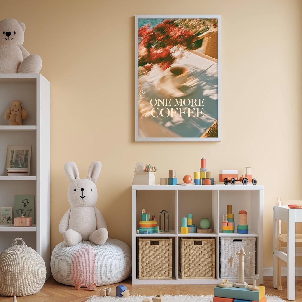 A cozy and colorful children's bedroom with a large stuffed bunny, a bookshelf, and a toy chest filled with toys. A framed poster with the text "ONE MORE COFFEE" is displayed on the wall above the bookshelf.