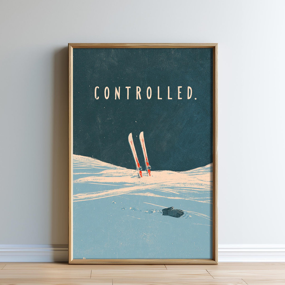 The image is a framed poster with a skiing scene and the word "controlled" written on it.