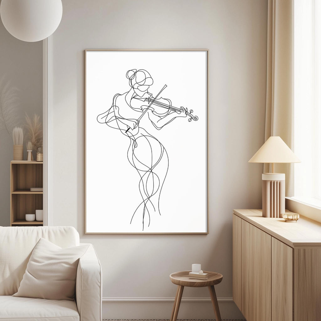 a living room with a white sofa, a wooden side table, and a framed drawing of a woman playing a violin.