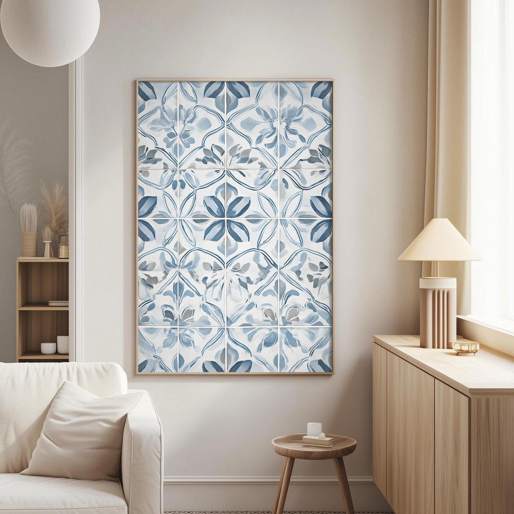 a cozy living room with a large blue and white patterned tile artwork hanging on the wall, a white sofa, a wooden side table, and a lamp on a wooden cabinet.