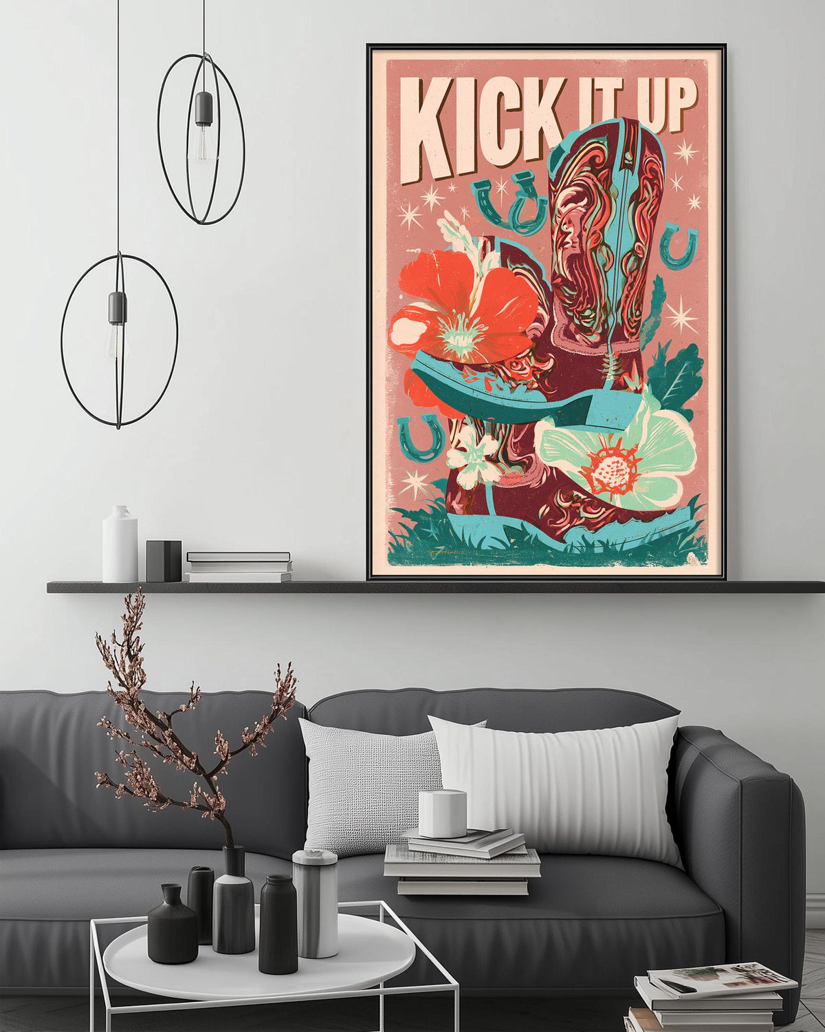 a large framed poster with a vibrant, colorful design hanging on a wall above a gray couch in a living room setting.