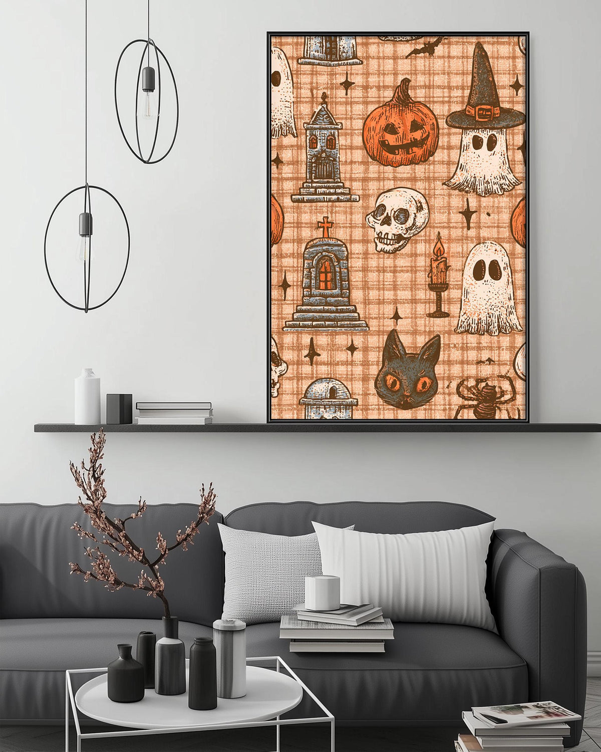 a living room with a gray sofa, a coffee table, and a large framed Halloween-themed print hanging on the wall above the sofa.