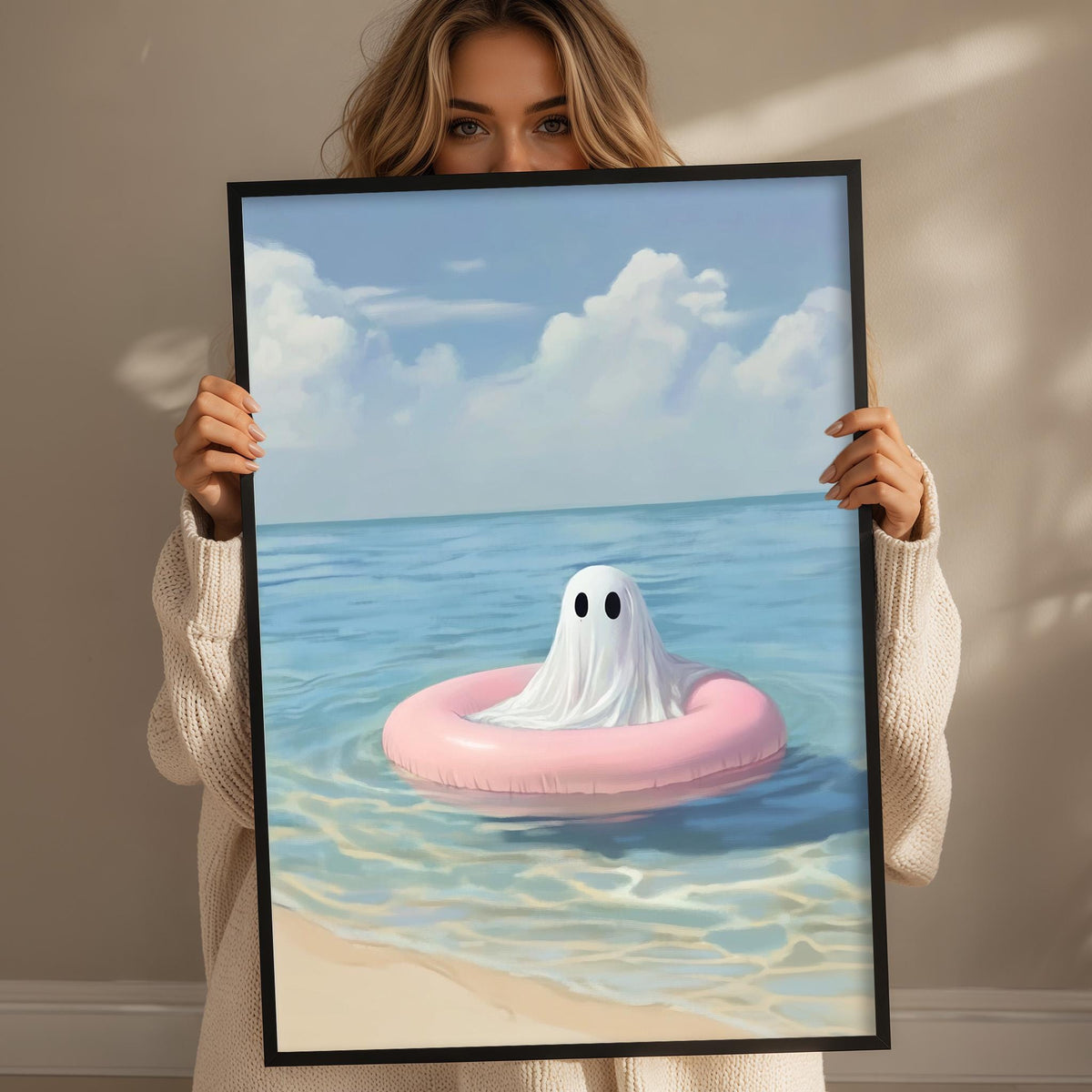 a woman holding a framed picture of a ghost floating on an inflatable ring in the ocean.