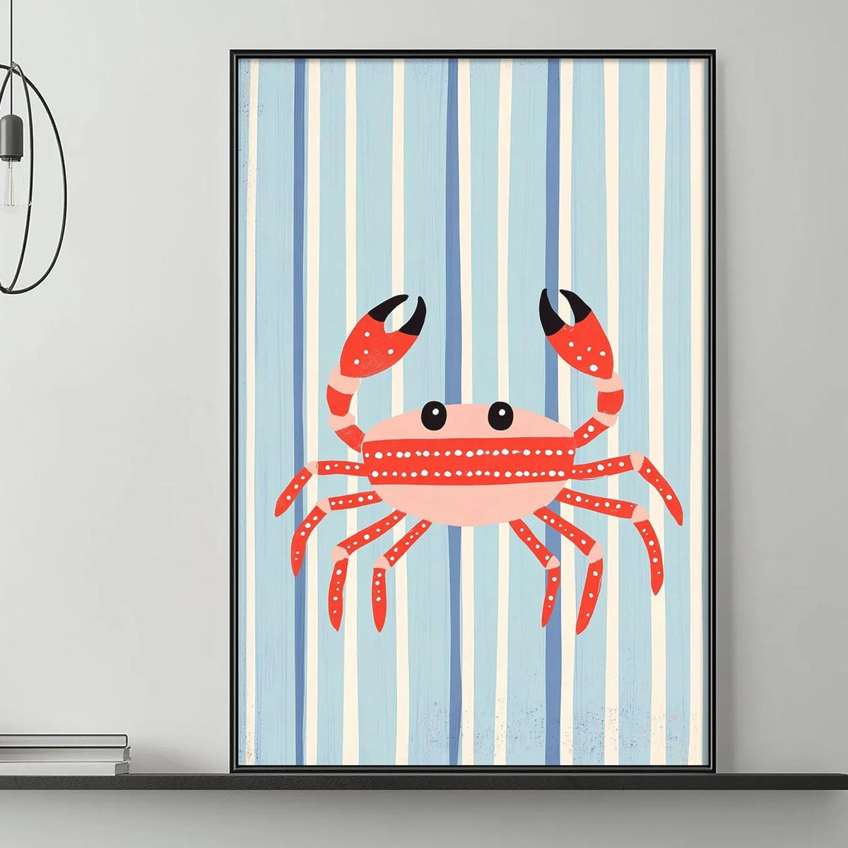 a living room with a gray couch, a coffee table, and a framed picture of a red crab on the wall.