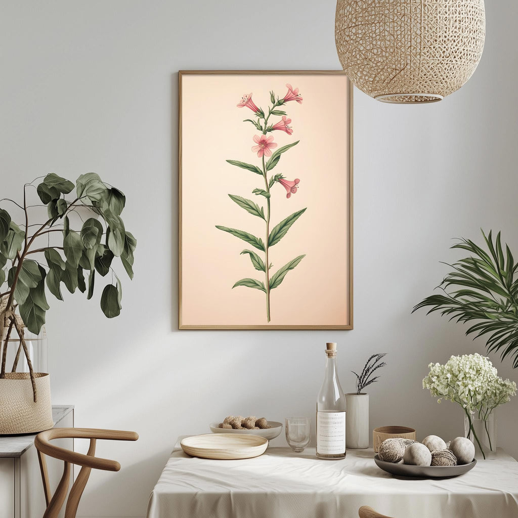 a dining table with a white tablecloth, a bowl of fruit, a bottle, and a vase with flowers. A framed botanical illustration of a plant is hanging on the wall above the table.
