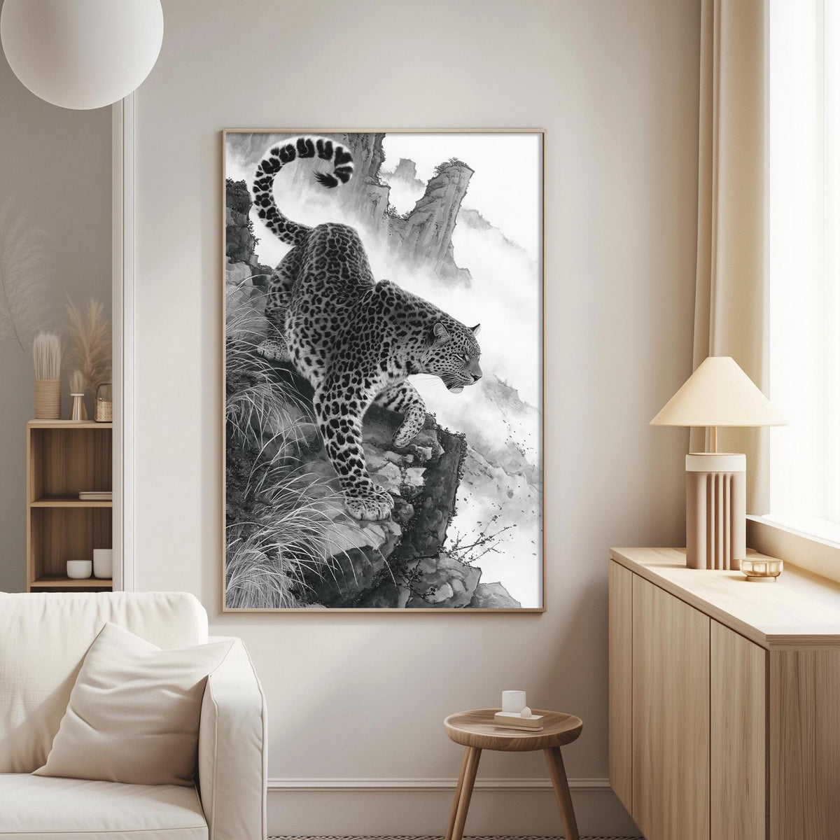 a large black and white photograph of a leopard climbing a rocky cliff, which is the central focus of the room.