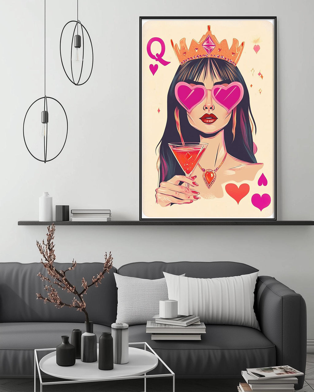 a large framed artwork depicting a woman wearing a crown and sunglasses, holding a drink, with hearts and a crown symbolizing love and power.