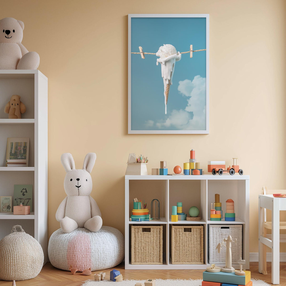 A cozy children's room with a white bookshelf, a plush rabbit, and a colorful toy box filled with toys. A framed artwork of an ice cream cone hanging from a clothesline is displayed on the wall, and a stuffed animal is sitting on a bean bag chair.