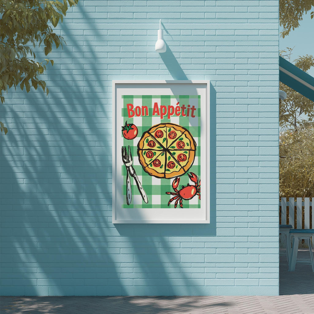 A framed poster with a pizza and crab illustration, mounted on a blue wall.