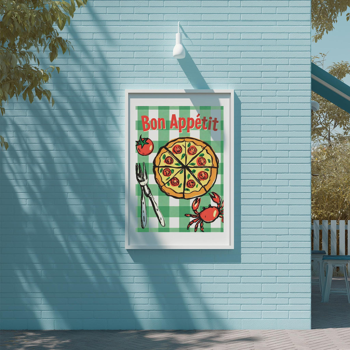 A framed poster with a pizza and crab illustration, mounted on a blue wall.