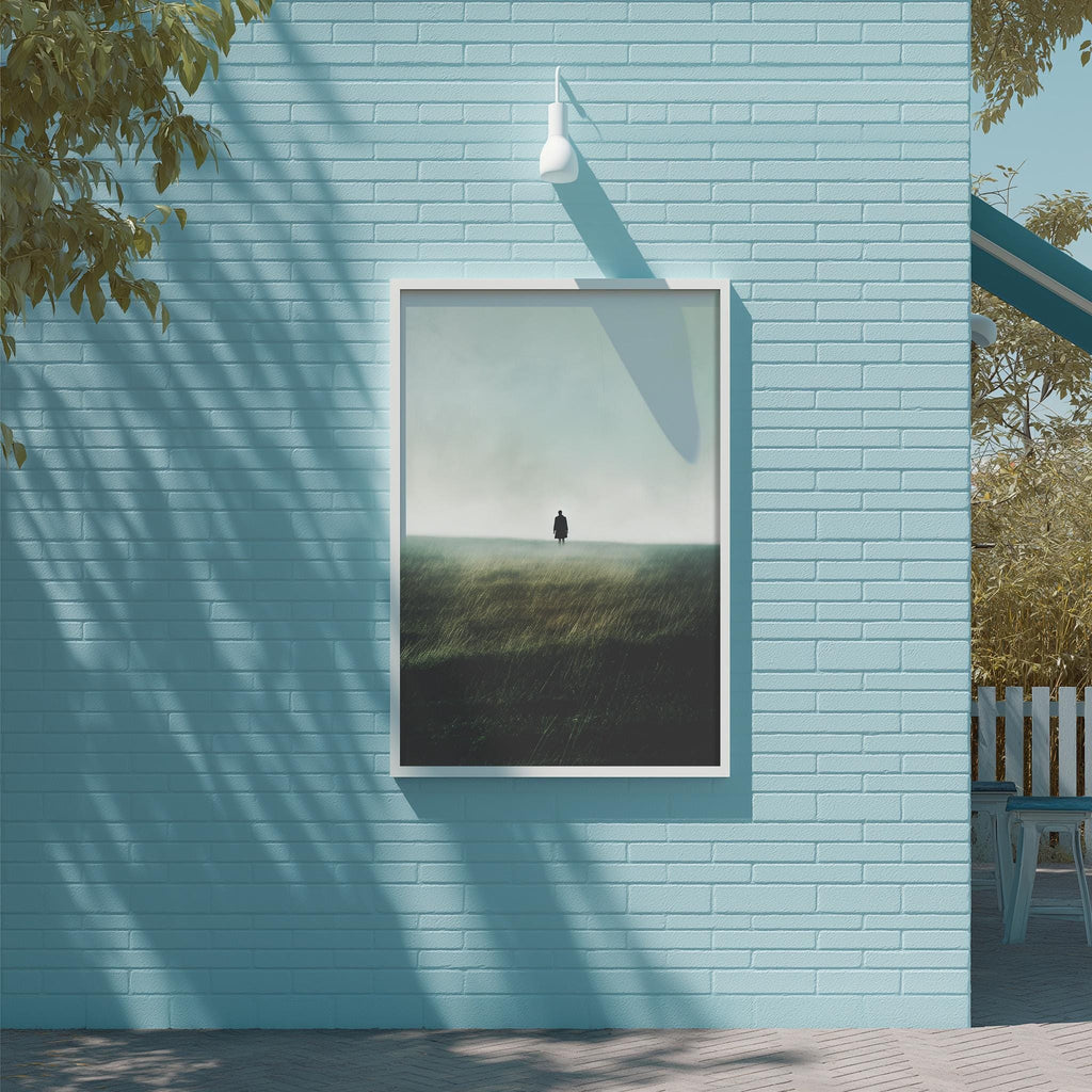 a blue brick wall with a framed picture of a person standing in a field, creating a serene and peaceful atmosphere.