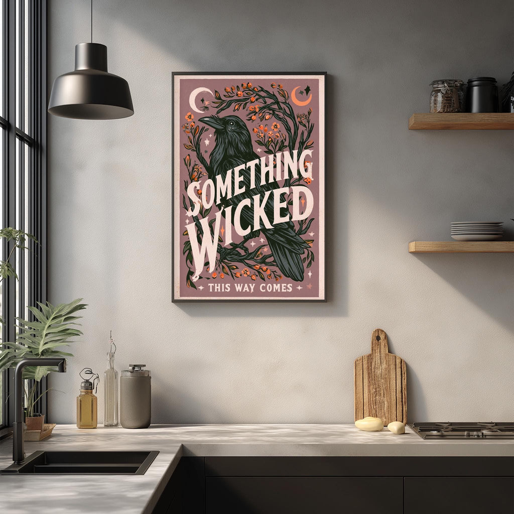 a framed poster with the text "SOMETHING WICKED" and "THIS WAY COMES" hanging on a wall above a kitchen counter.