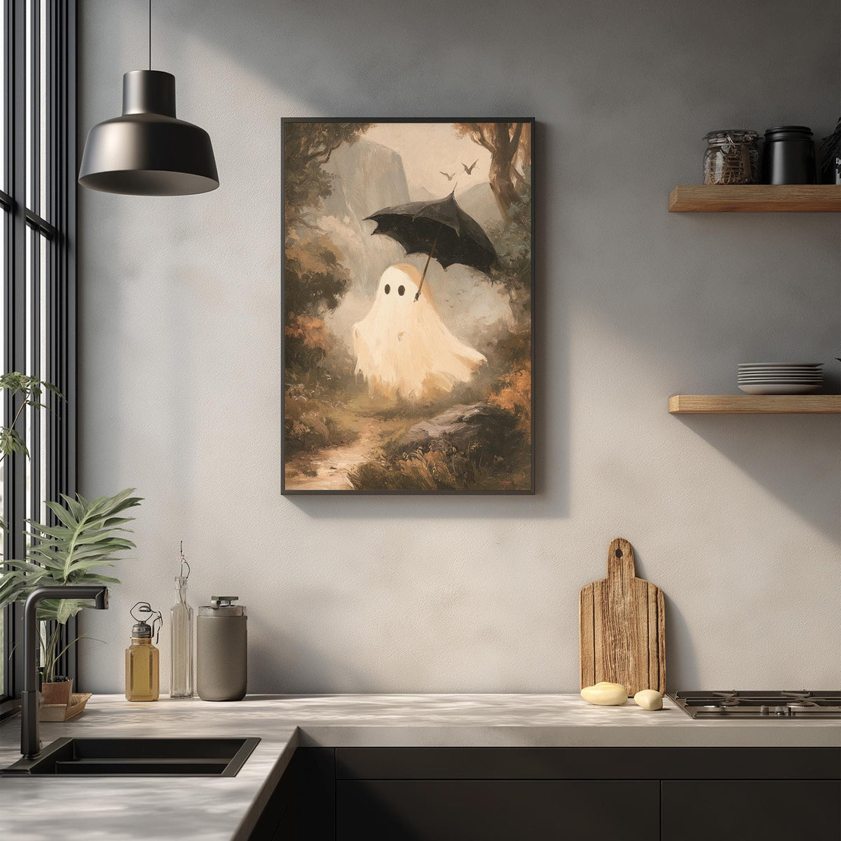 a kitchen counter with various items, including a framed painting of a ghost, a hanging lamp, and a wooden cutting board.
