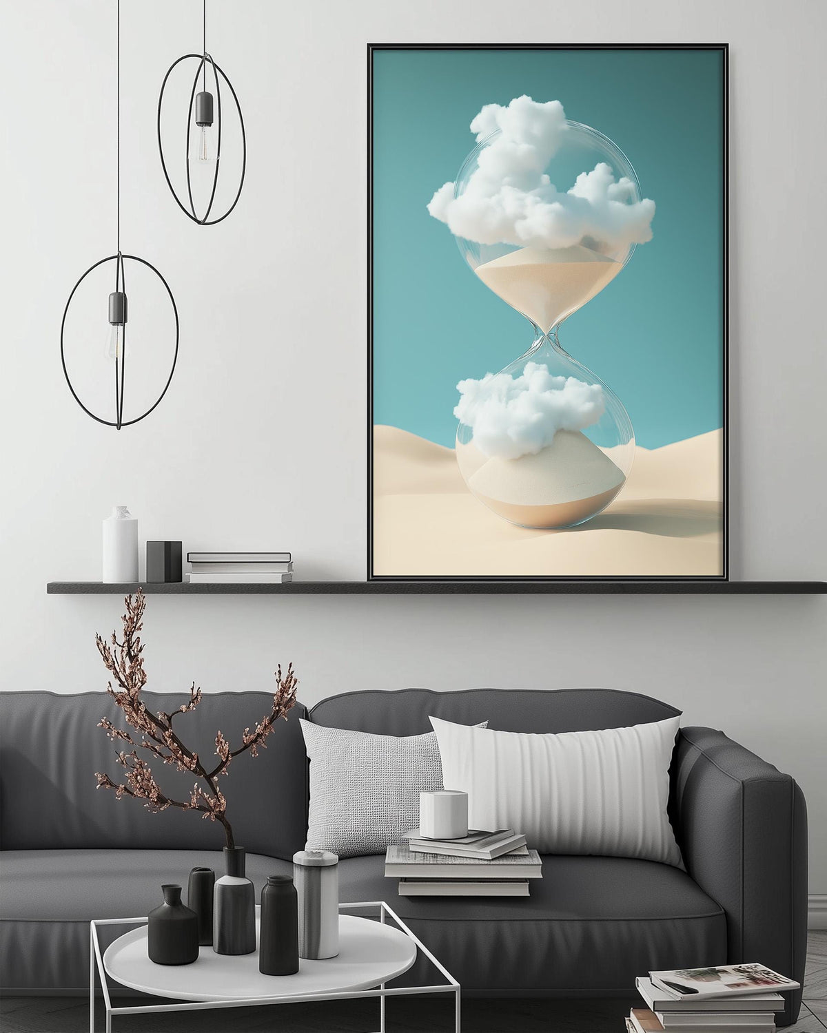 a modern living room with a gray sofa, a coffee table, and a large framed artwork depicting a glass hourglass with clouds on a sandy beach.