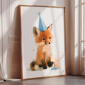A framed watercolor painting of a fox wearing a blue party hat, with a birthday candle in front of it.