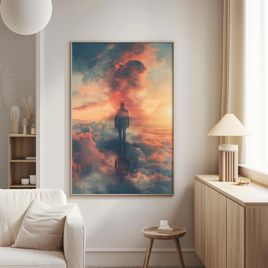 a large framed painting of a person standing in the clouds, with a warm and vibrant sunset in the background.
