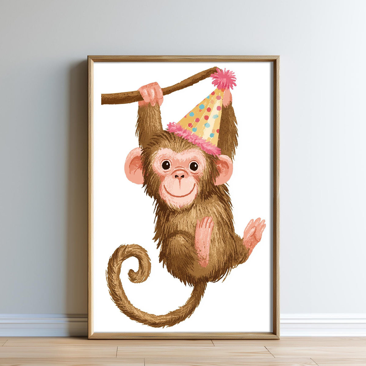 A framed illustration of a monkey wearing a party hat.