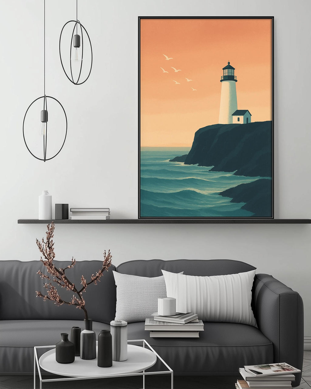 a living room with a gray sofa, a coffee table, and a large framed picture of a lighthouse on the wall above the sofa.