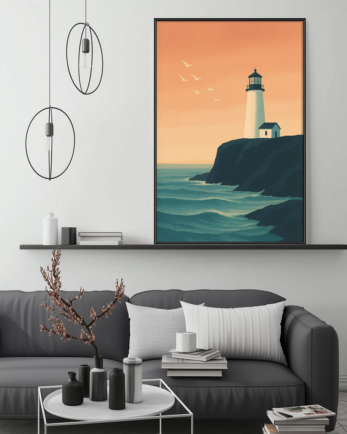 a living room with a gray sofa, a coffee table, and a large framed picture of a lighthouse on the wall above the sofa.