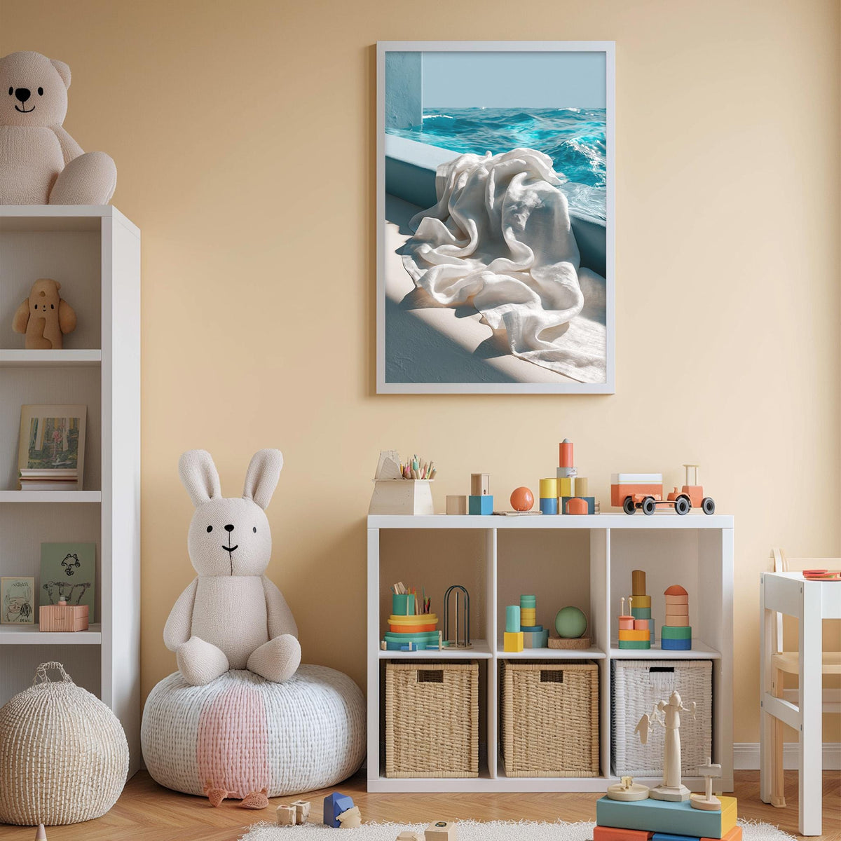 A cozy children's room with a white rabbit sitting on a bean bag chair, surrounded by toys and a bookshelf. A framed picture of a beach scene hangs on the wall above the bookshelf.