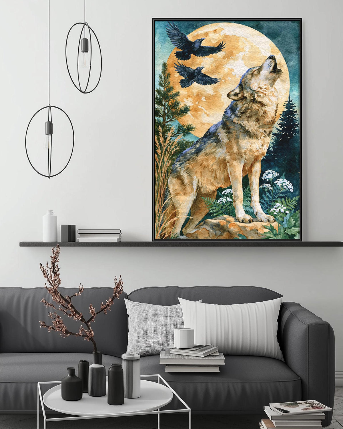 a large framed painting of a wolf howling at a full moon, hanging on a wall above a gray couch with a coffee table in front of it.