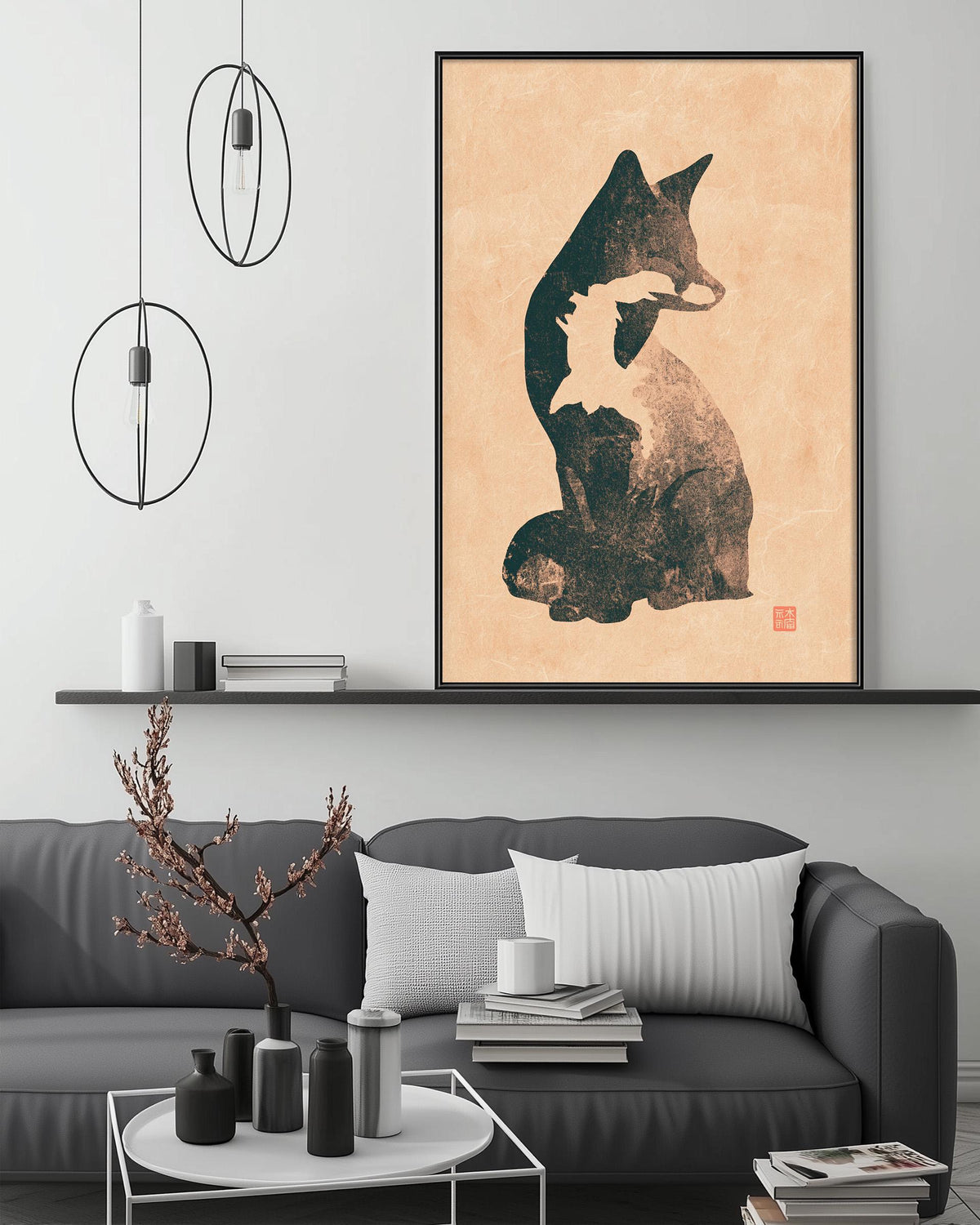 a modern living room with a gray sofa, a coffee table, and a framed artwork of a cat on the wall.