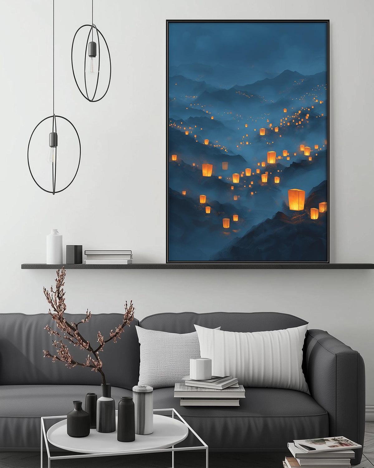 a modern living room with a gray sofa, a coffee table, and a large framed artwork depicting a serene landscape with floating lanterns.