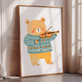 A framed illustration of a bear playing a violin.
