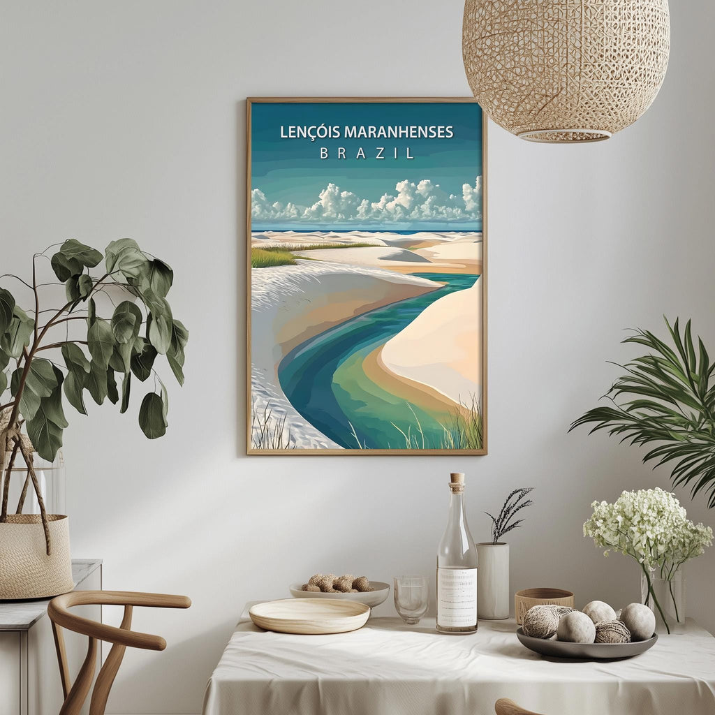 a framed poster of a beach scene with a river, hanging on a wall above a dining table with various decorative items and plants.