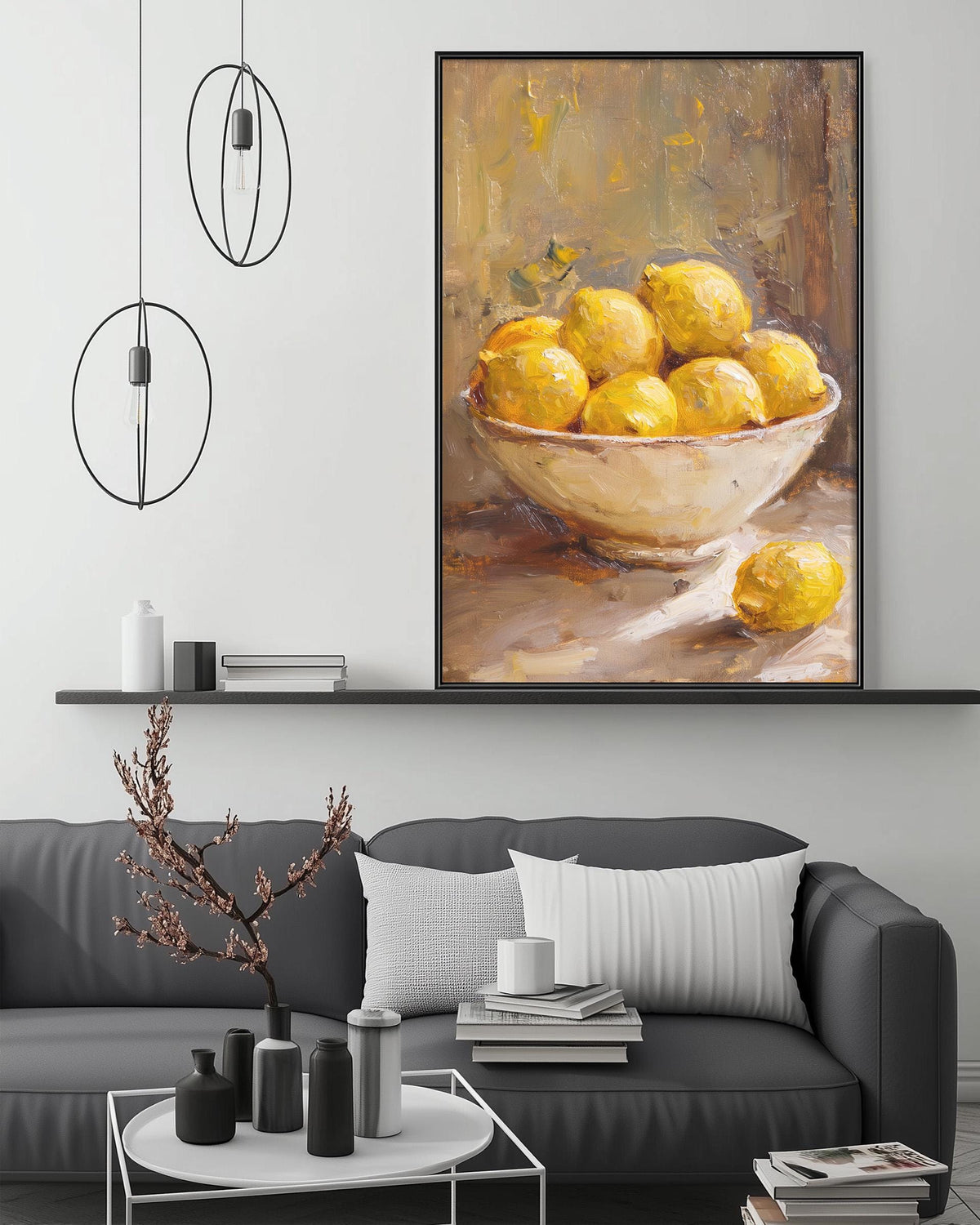 a modern living room with a gray sofa, a coffee table, and a large painting of lemons on the wall above the sofa.