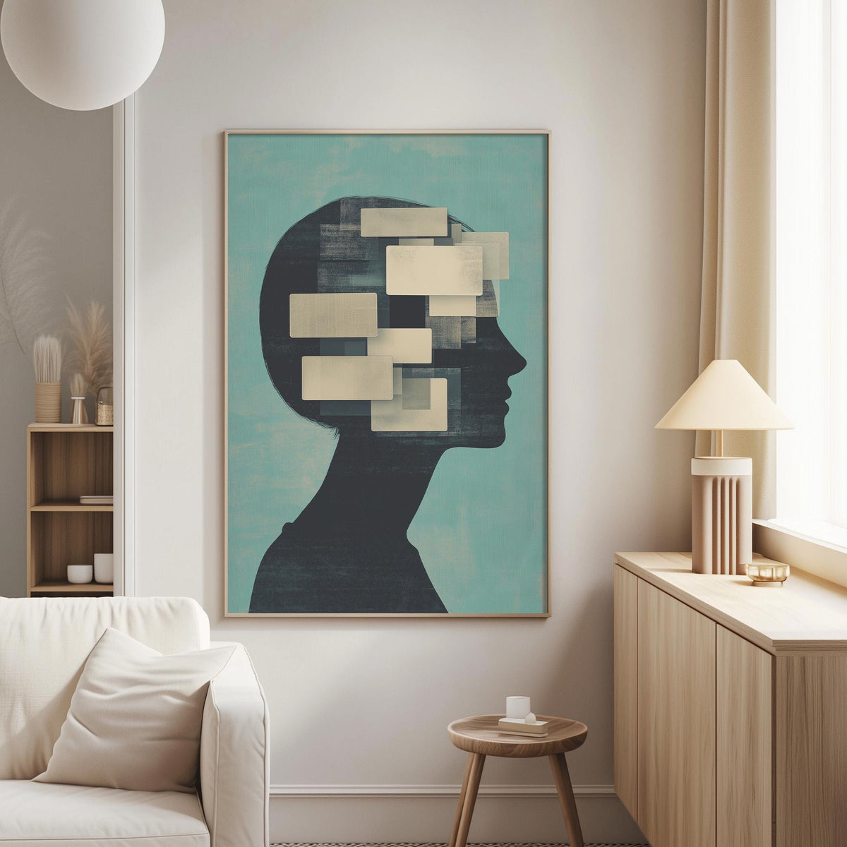 a living room with a large abstract painting of a head on the wall, a white sofa, a wooden side table, and a lamp.