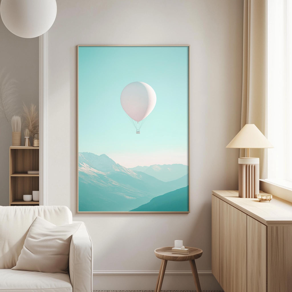 a serene living room with a large framed picture of a hot air balloon floating in the sky above a mountainous landscape.