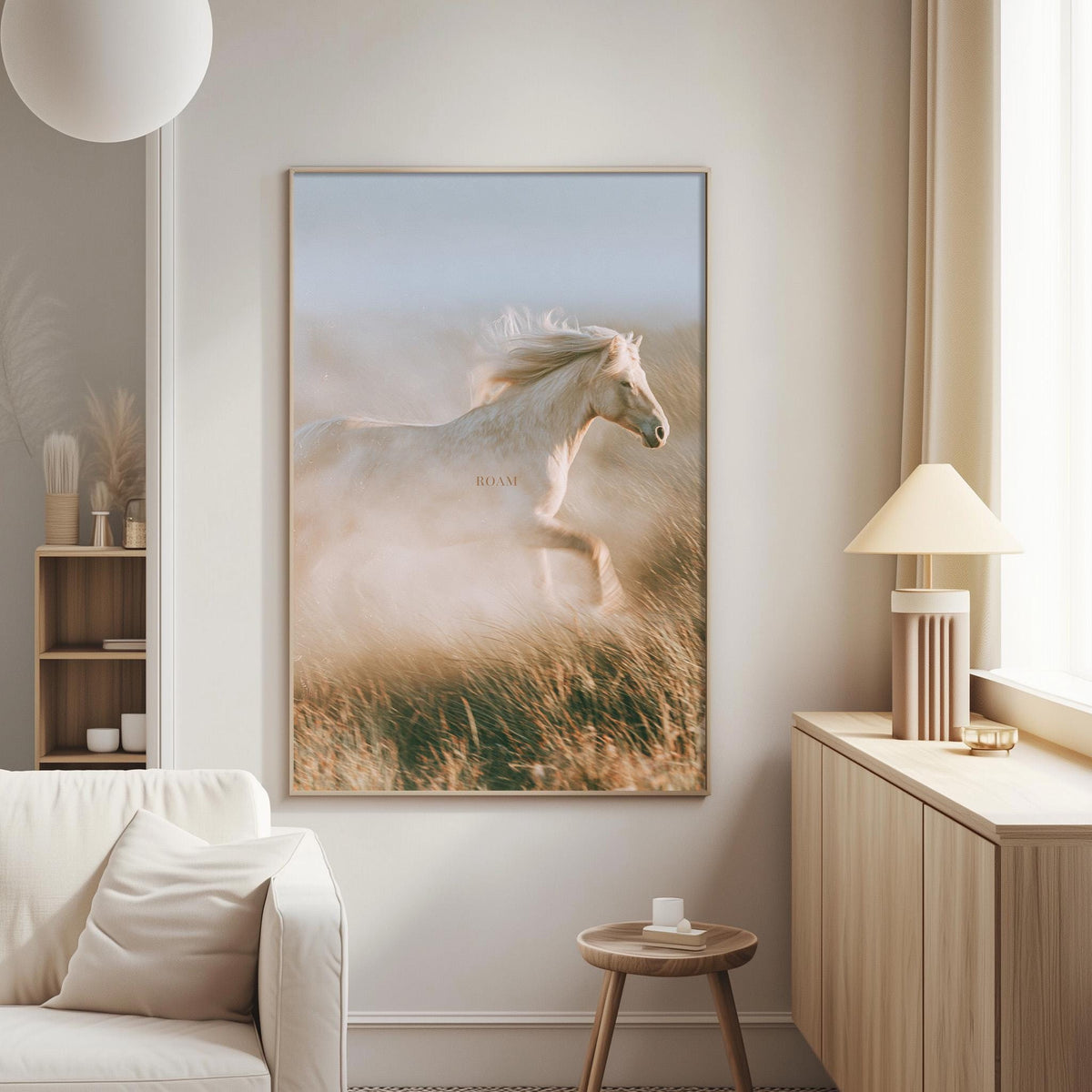 a large, framed photograph of a horse running in a field, with the word "ROMA" visible on the horse's head. The photograph is displayed on a wall in a living room setting, with a white couch and a small side table visible in the background.