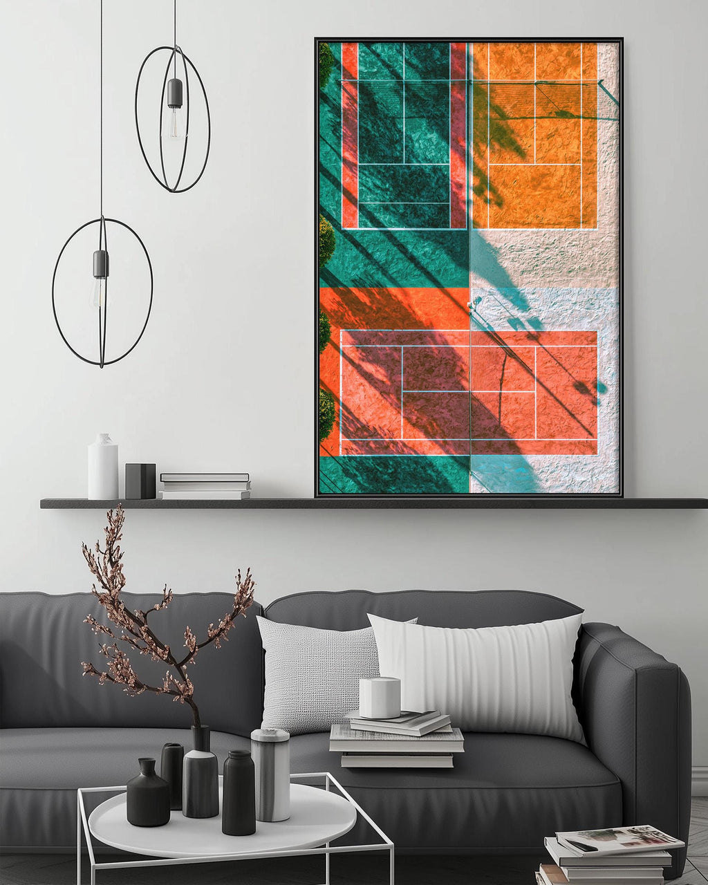 a modern living room with a gray sofa, a coffee table, and a large abstract painting hanging on the wall above the sofa.