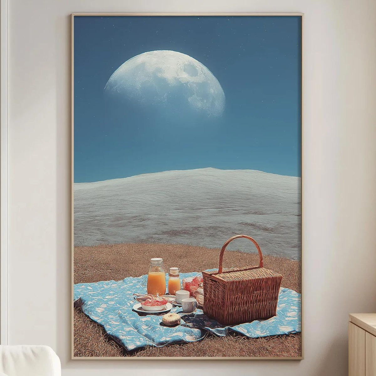 a serene beach scene with a picnic basket, a blue blanket, and a basket of food on the sand, set against a backdrop of a large moon.