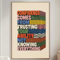 a poster with a motivational message hanging on a wall in a living room.