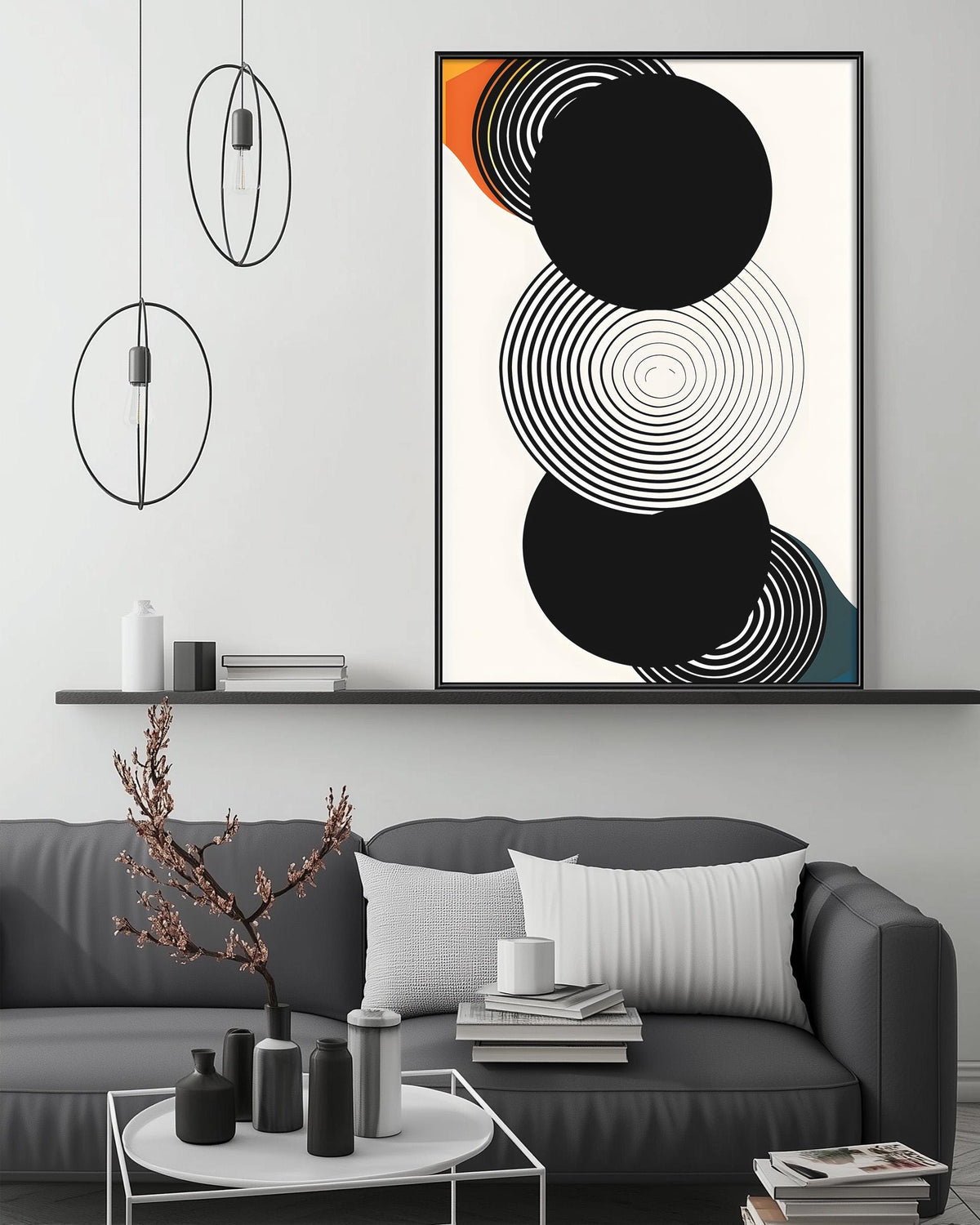a modern living room with a gray sofa, a coffee table, and a large abstract art piece hanging on the wall above the sofa.