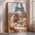A poodle wearing sunglasses is sitting at a table with a croissant and a cup of coffee, with the Eiffel Tower visible in the background.